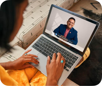 A customer using a laptop to video chat with a TurboTax tax expert.